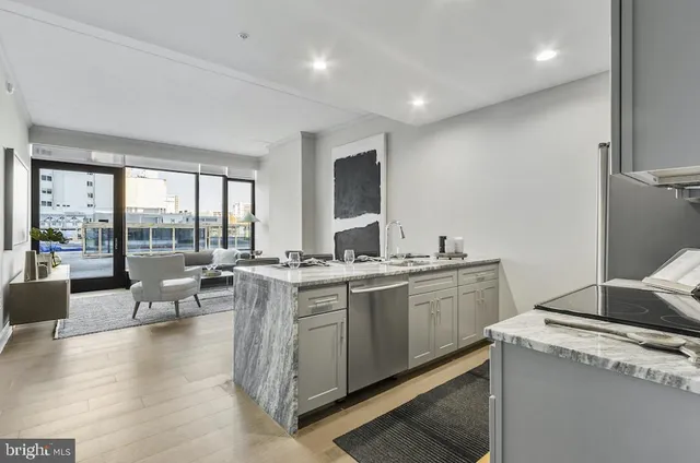 a open kitchen with sink stove and cabinets