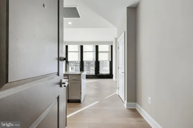 a view of an entryway with wooden floor