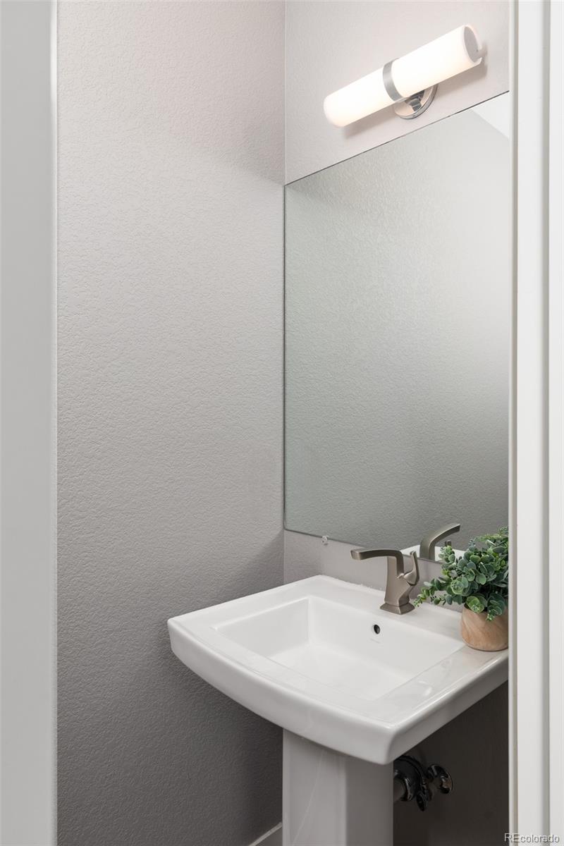 5230 Stuart Street Denver, CO 80212 - Photo 13 of 34 a bathroom with a sink and a mirror