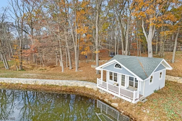a house with a trees in front of it