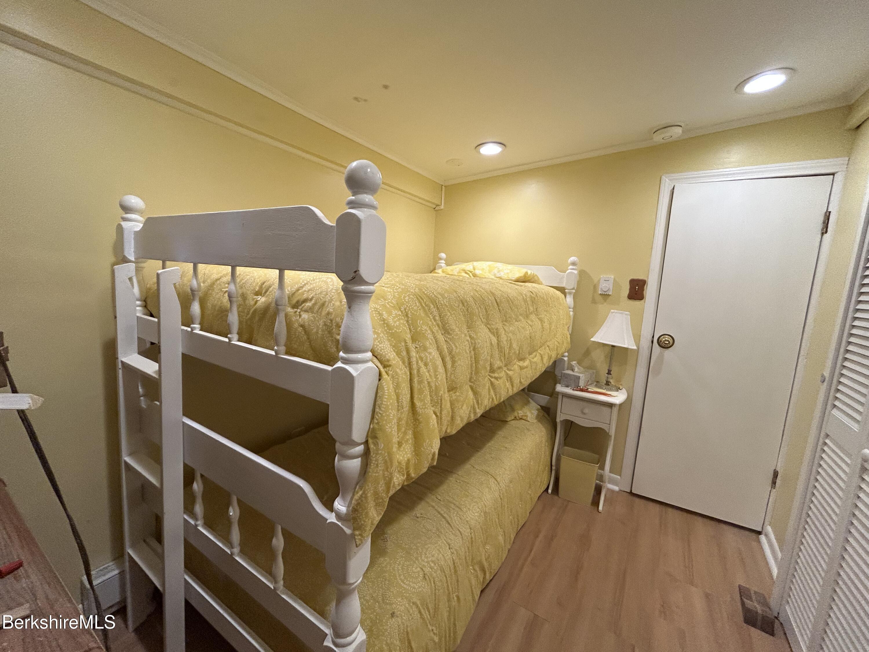 369 Pine Road Otis, MA 01029 - Photo 3 of 12 a bedroom with a bed and a table