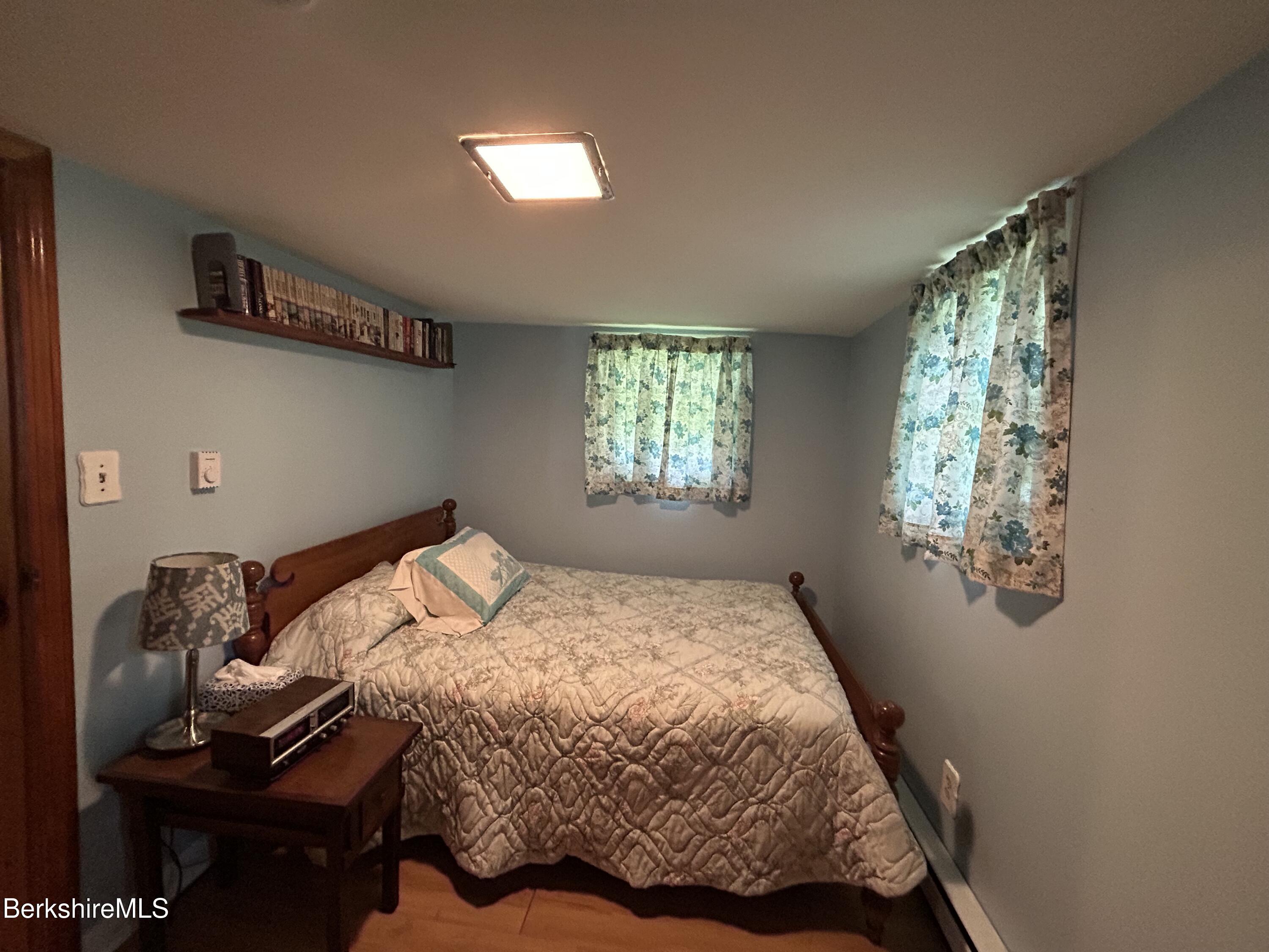 369 Pine Road Otis, MA 01029 - Photo 4 of 12 a bedroom with a bed and a window