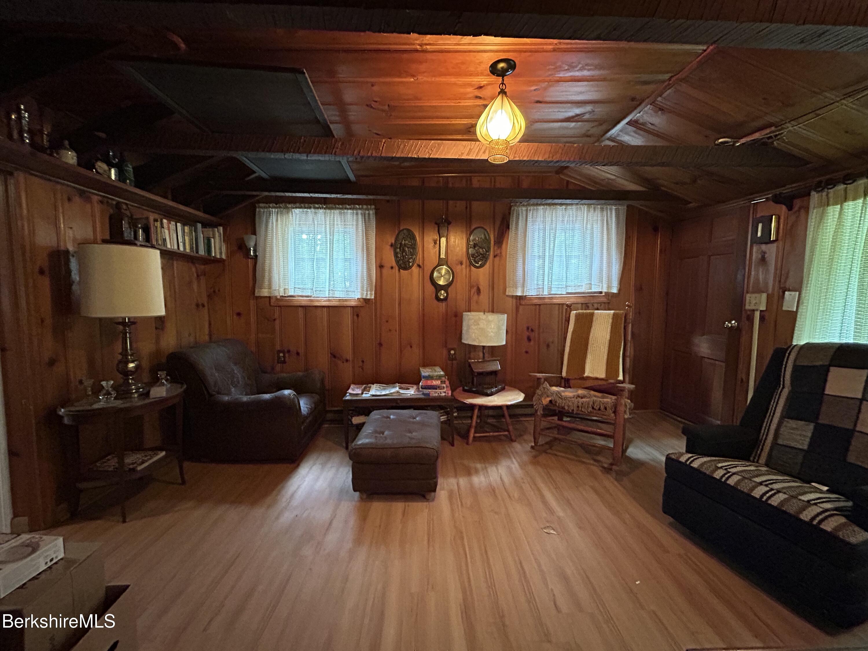 369 Pine Road Otis, MA 01029 - Photo 5 of 12 a living room with furniture and a wooden floor