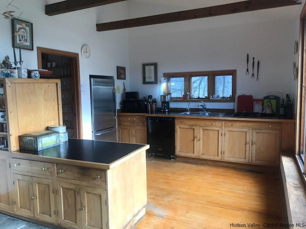 445 Plutarch Road Highland, NY 12528 - Photo 13 of 35 a kitchen with stainless steel appliances granite countertop a sink and a refrigerator