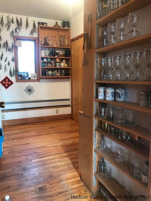 445 Plutarch Road Highland, NY 12528 - Photo 17 of 35 a kitchen with stainless steel appliances wooden floor and a refrigerator
