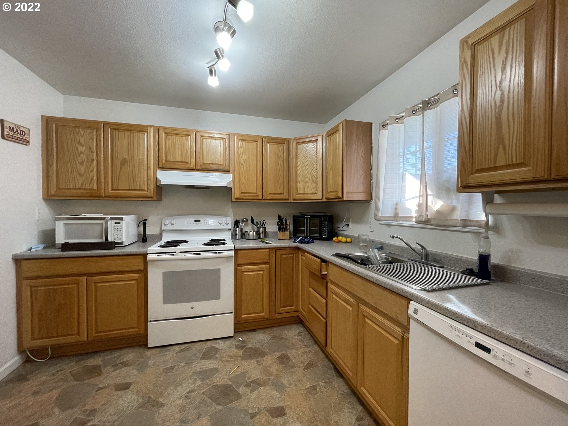 868 Blanco Avenue Coos Bay, OR 97420 - Photo 17 of 29 a kitchen with a sink cabinets and window