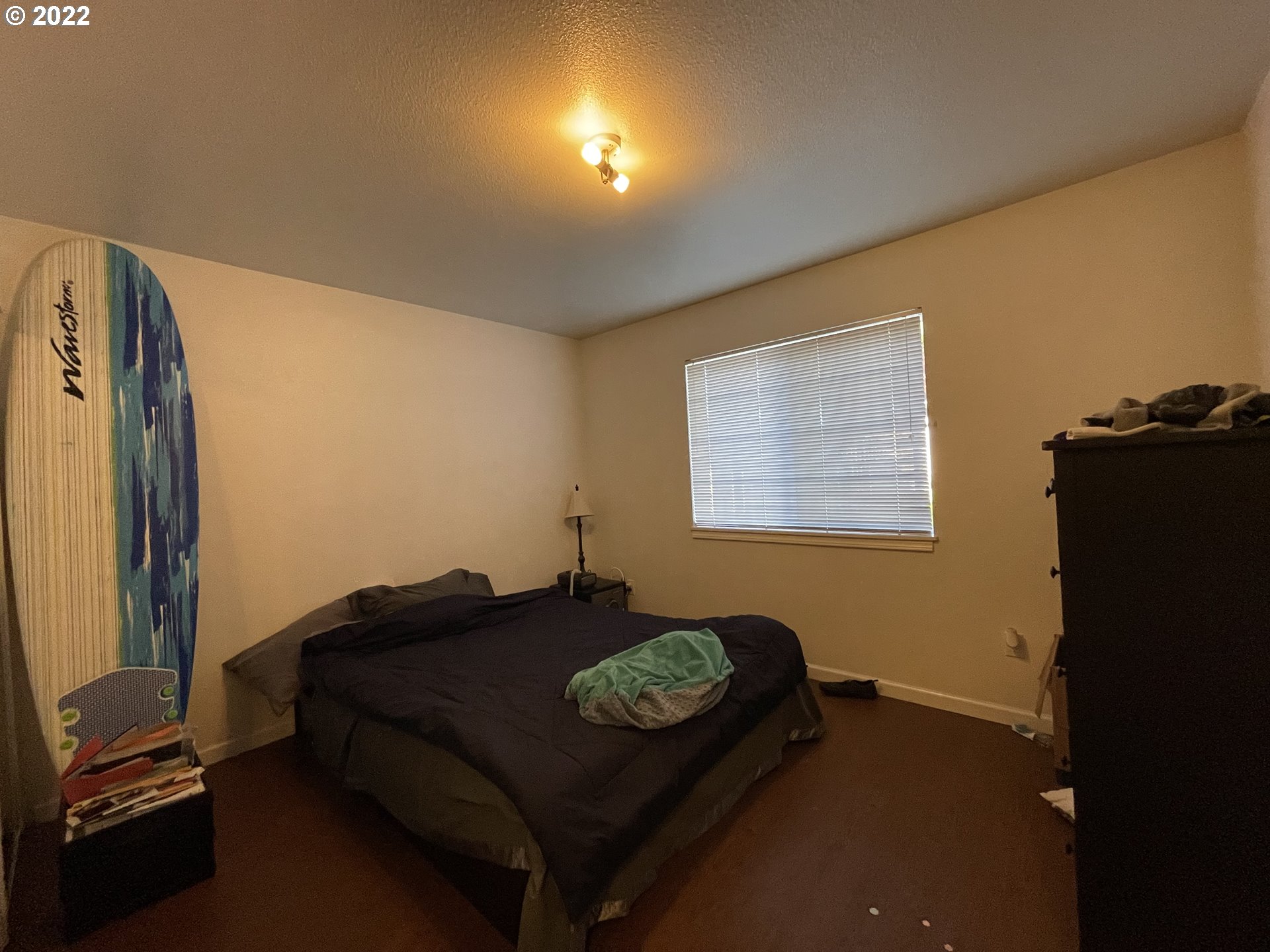 868 Blanco Avenue Coos Bay, OR 97420 - Photo 21 of 29 a bed sitting in a room next to a window
