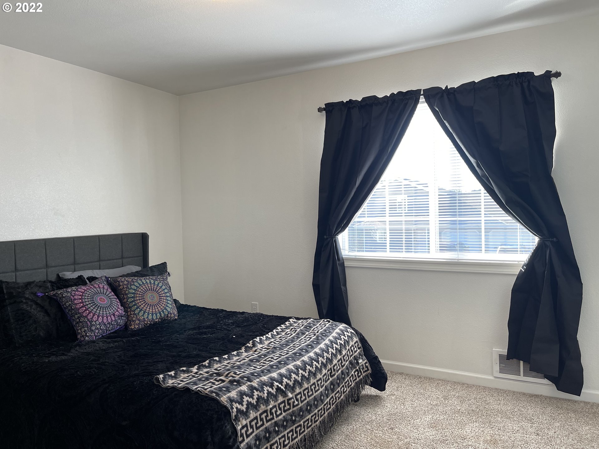 868 Blanco Avenue Coos Bay, OR 97420 - Photo 28 of 29 a bedroom with a bed and window