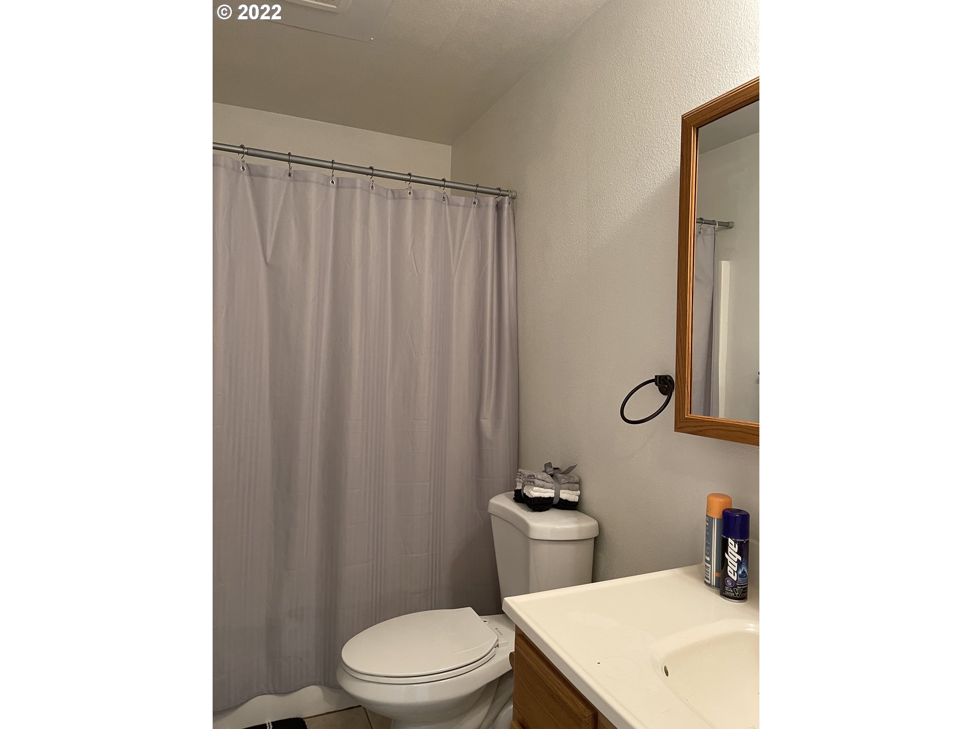 868 Blanco Avenue Coos Bay, OR 97420 - Photo 29 of 29 a bathroom with a toilet a sink and shower