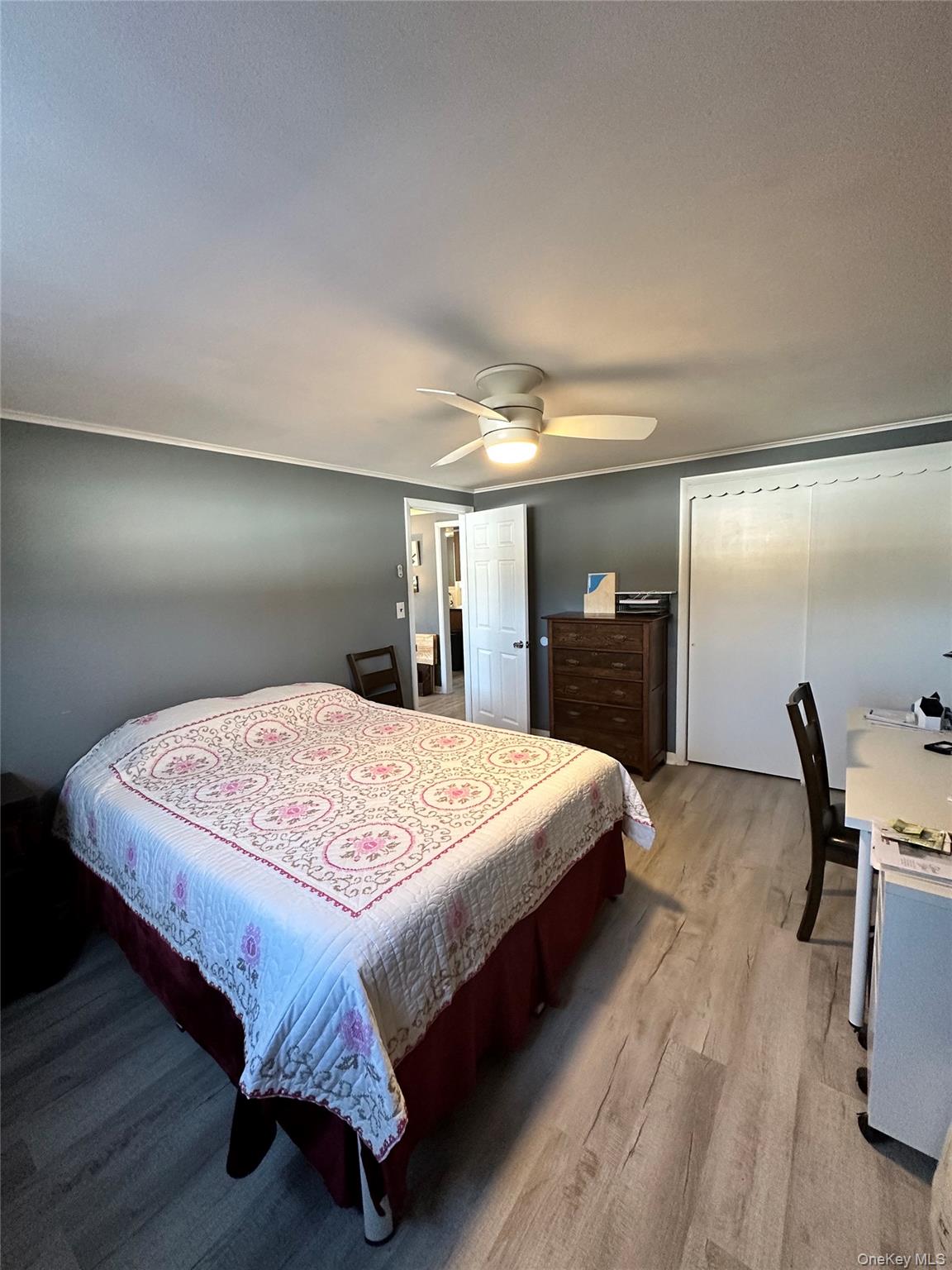 35 Glenmere Road, Unit A Chester, NY 10918 - Photo 9 of 13 a bed sitting in a bedroom and wooden floor