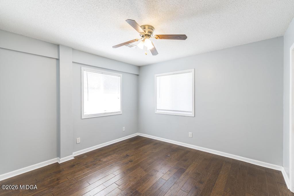 3710 Sandy Circle Macon, GA 31216 - Photo 34 of 44 an empty room with wooden floor window and ceiling fan