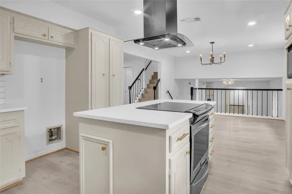 a kitchen with a sink and stove