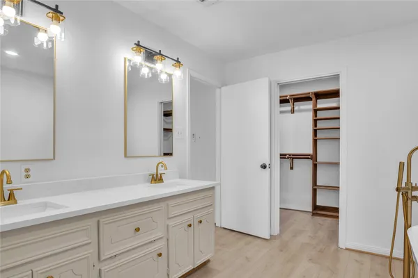 a bathroom with a white toilet and a sink