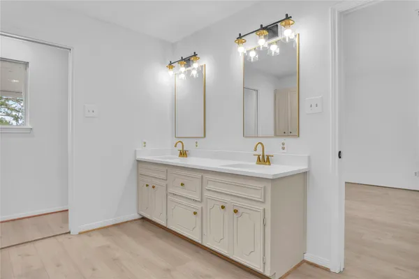 a white toilet sitting next to a bathroom sink