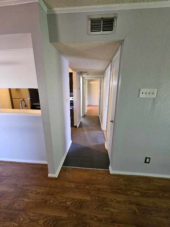 1505 Ward Road, Unit 112 Baytown, TX 77520 - Photo 11 of 15 a view of a hallway with wooden floor and a bathroom