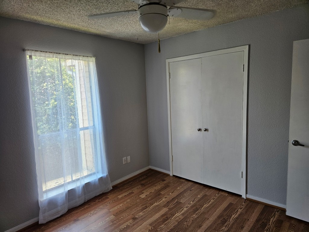 1505 Ward Road, Unit 112 Baytown, TX 77520 - Photo 14 of 15 a view of an empty room with wooden floor and a window