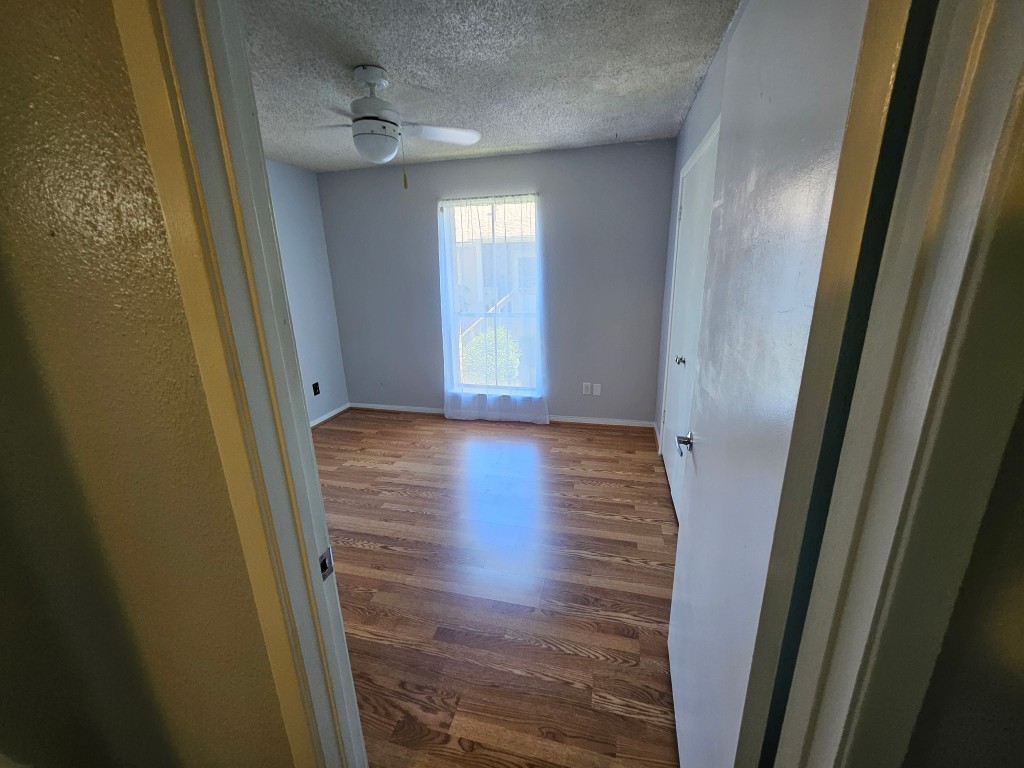 1505 Ward Road, Unit 112 Baytown, TX 77520 - Photo 10 of 15 a view of a hallway with wooden floor