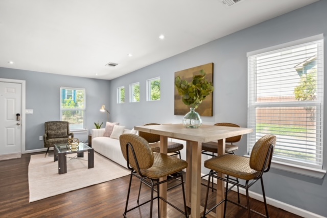 1183 Coleto Street Austin, TX 78702 - Photo 5 of 17 a view of a dining room with furniture window and wooden floor