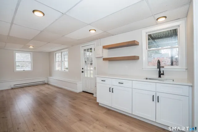 a bathroom with a sink and mirror