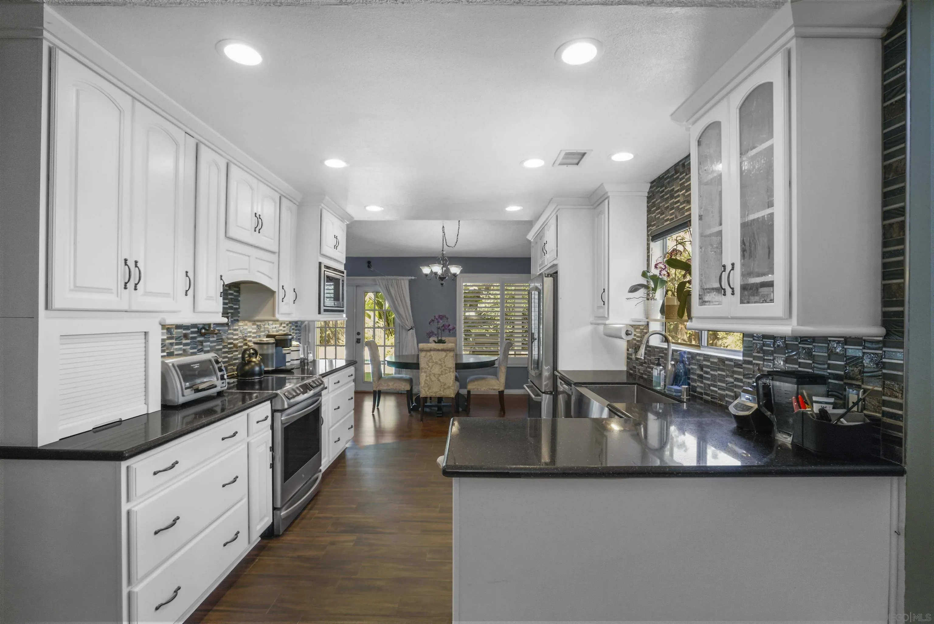 4660 Lofty Grove Drive Oceanside, CA 92056 - Photo 11 of 22 a kitchen with sink stove and cabinets