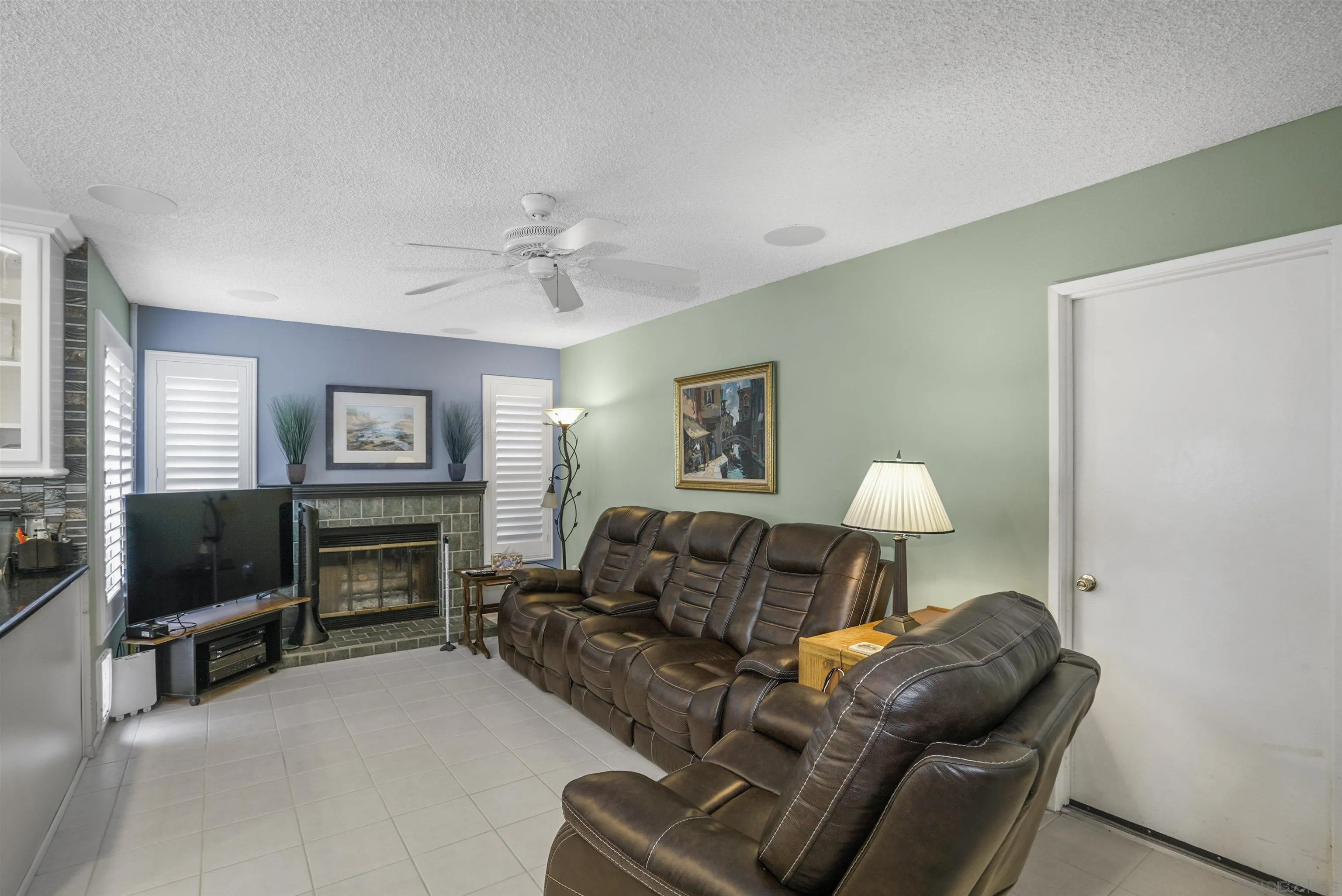 4660 Lofty Grove Drive Oceanside, CA 92056 - Photo 12 of 22 a living room with furniture and a flat screen tv
