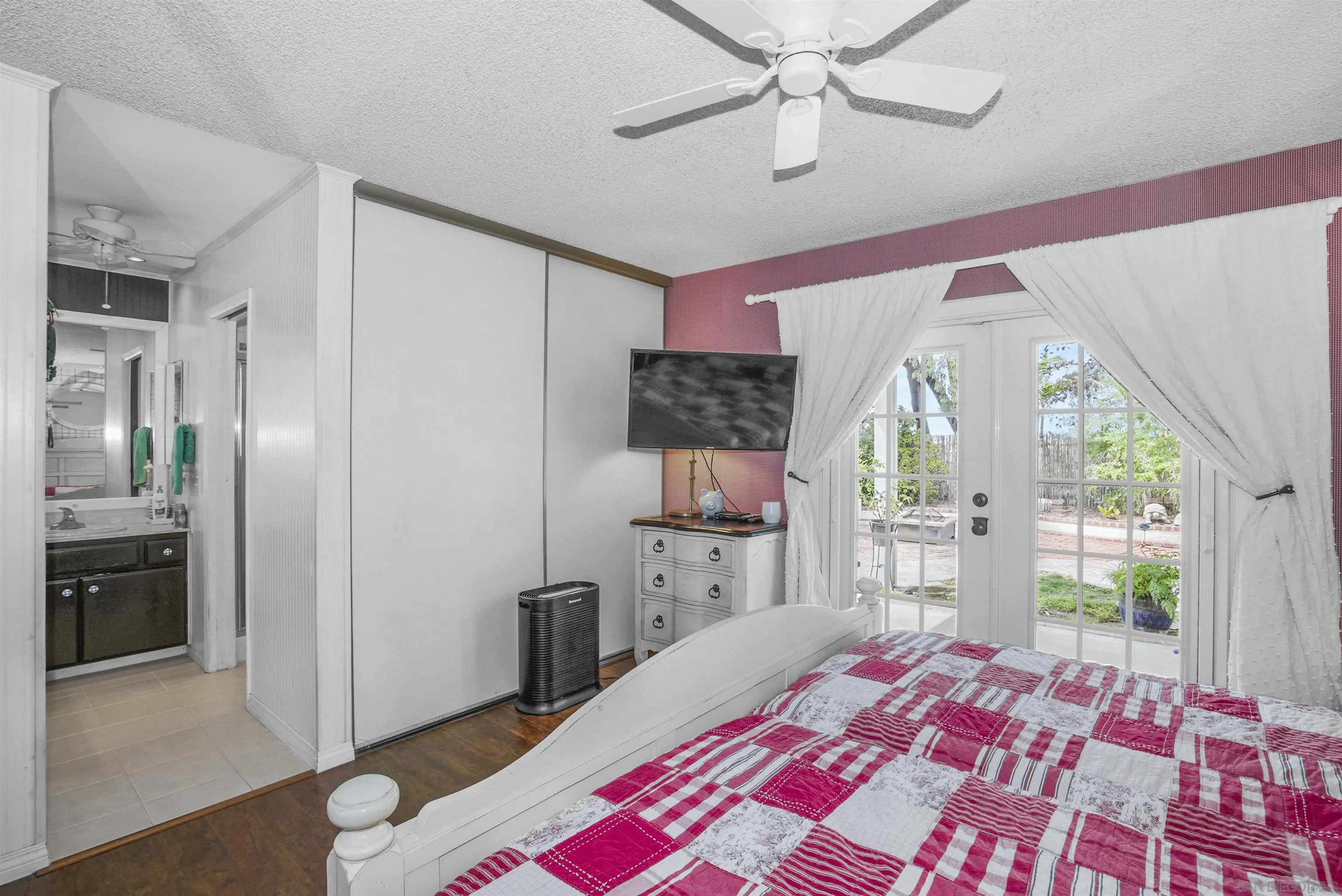 4660 Lofty Grove Drive Oceanside, CA 92056 - Photo 14 of 22 a bedroom with a bed and a dresser