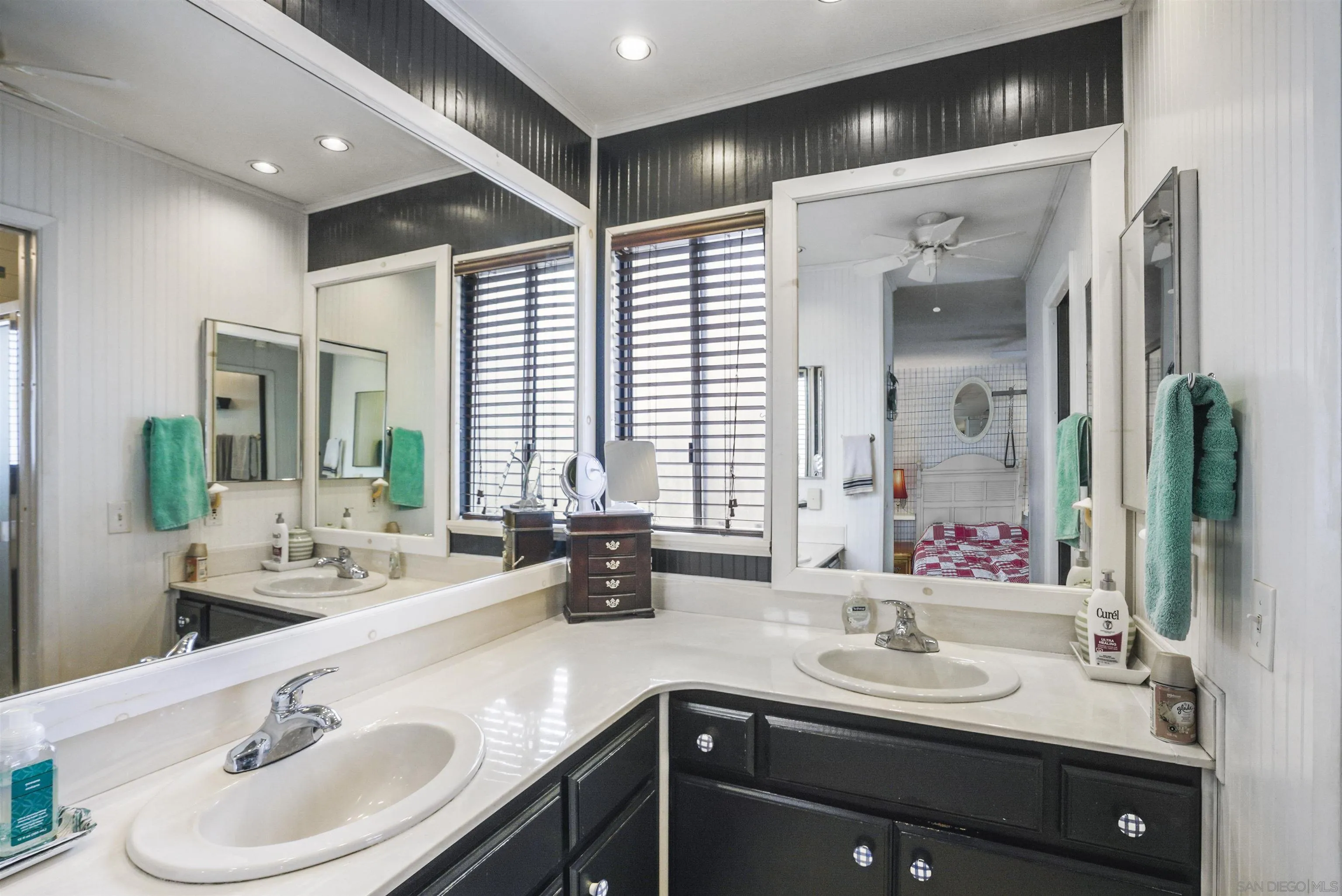 4660 Lofty Grove Drive Oceanside, CA 92056 - Photo 15 of 22 a bathroom with a sink double vanity and a mirror