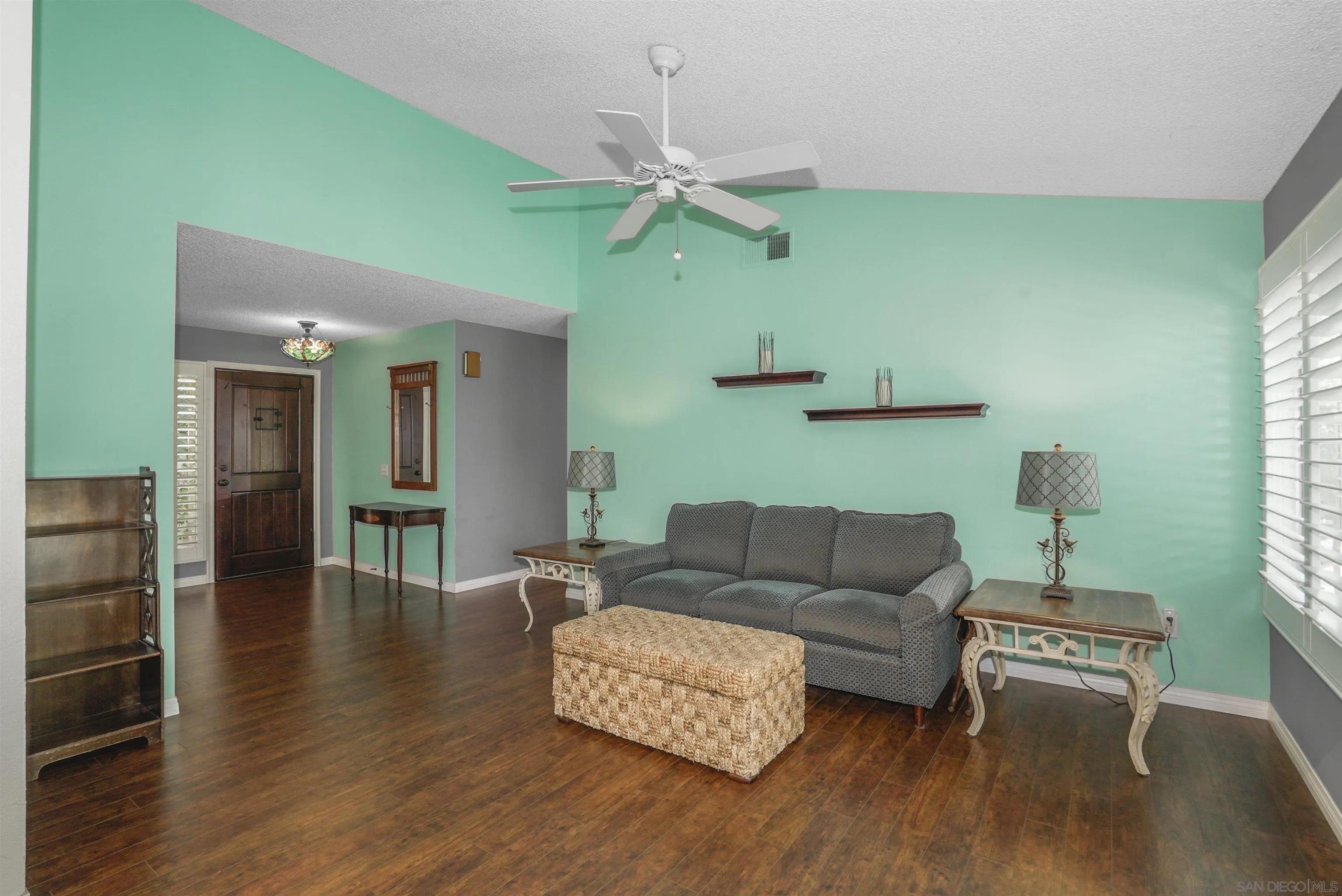 4660 Lofty Grove Drive Oceanside, CA 92056 - Photo 6 of 22 a living room with furniture and a wooden floor