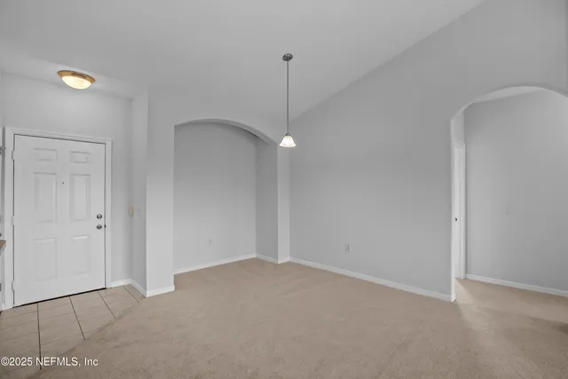 a bedroom with bed and a potted plant