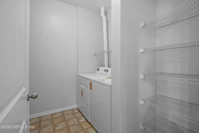 a view of a balcony with chair and potted plant