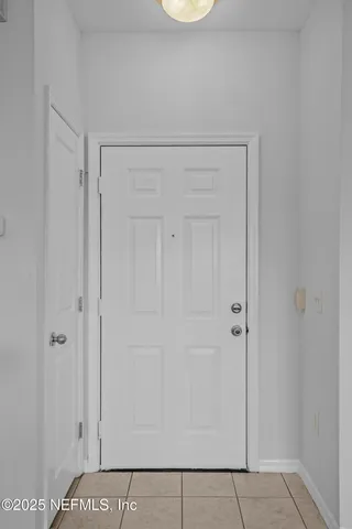 a view of a dining room with furniture and a large window