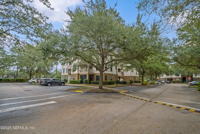 an aerial view of a house with a garden and swimming pool