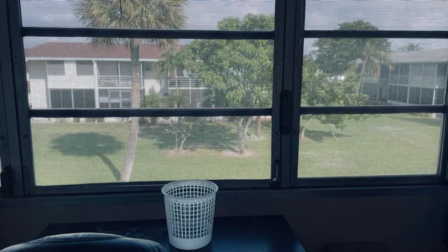 a bathroom with a sink and mirror with toilet