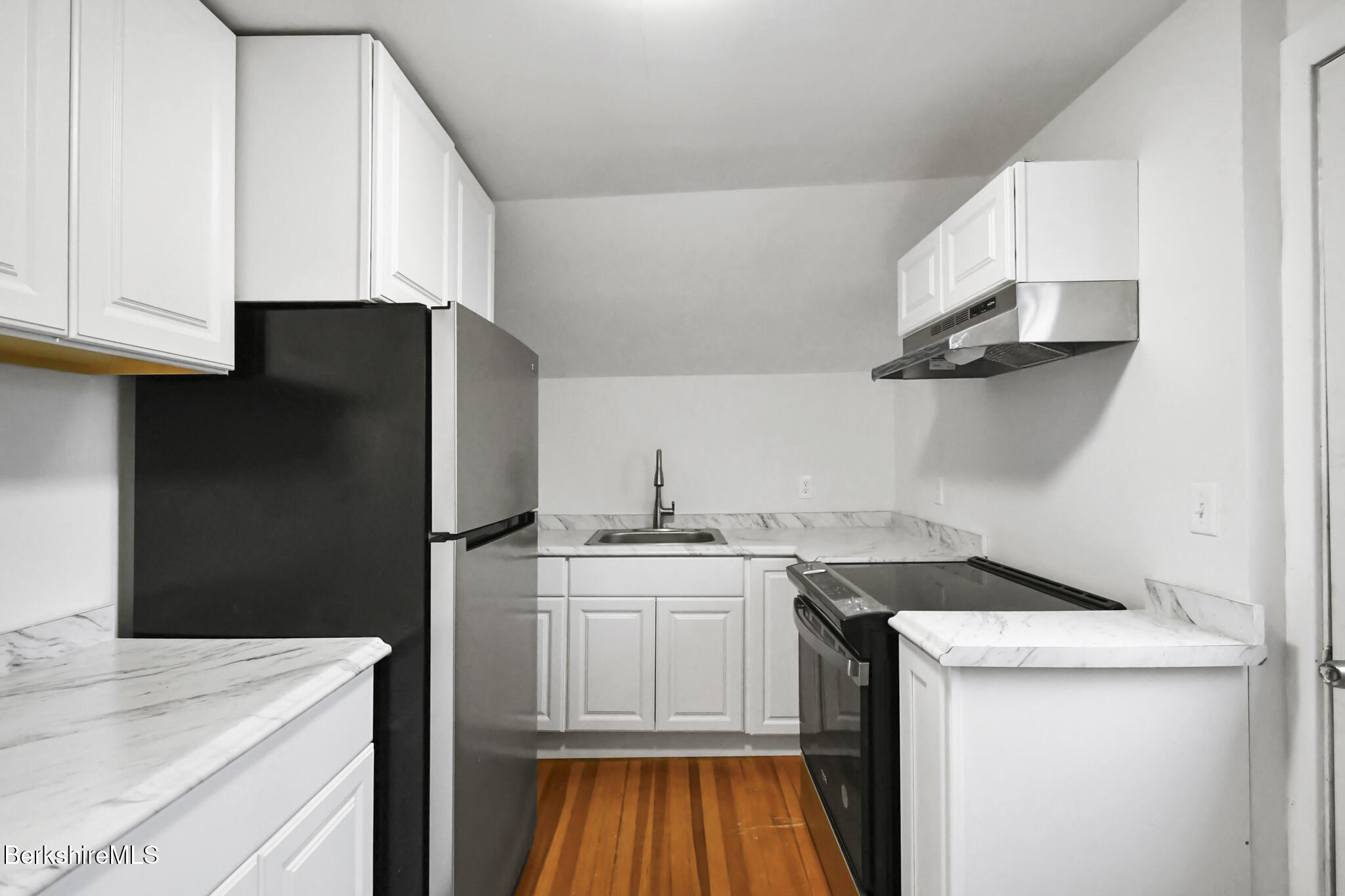 111 Columbia Street Adams, MA 01220 - Photo 12 of 33 a kitchen with a sink and a refrigerator