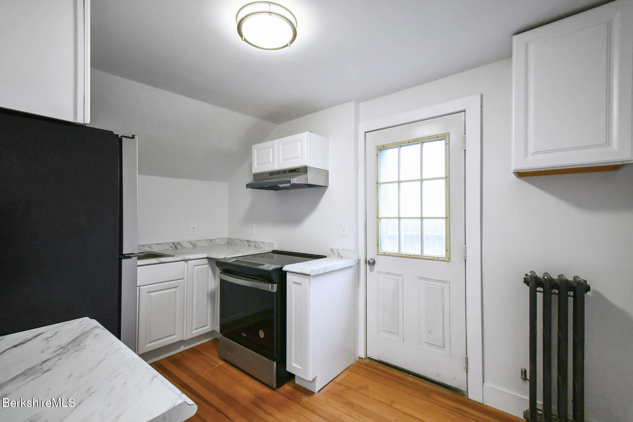 111 Columbia Street Adams, MA 01220 - Photo 13 of 33 a kitchen with a stove and a refrigerator