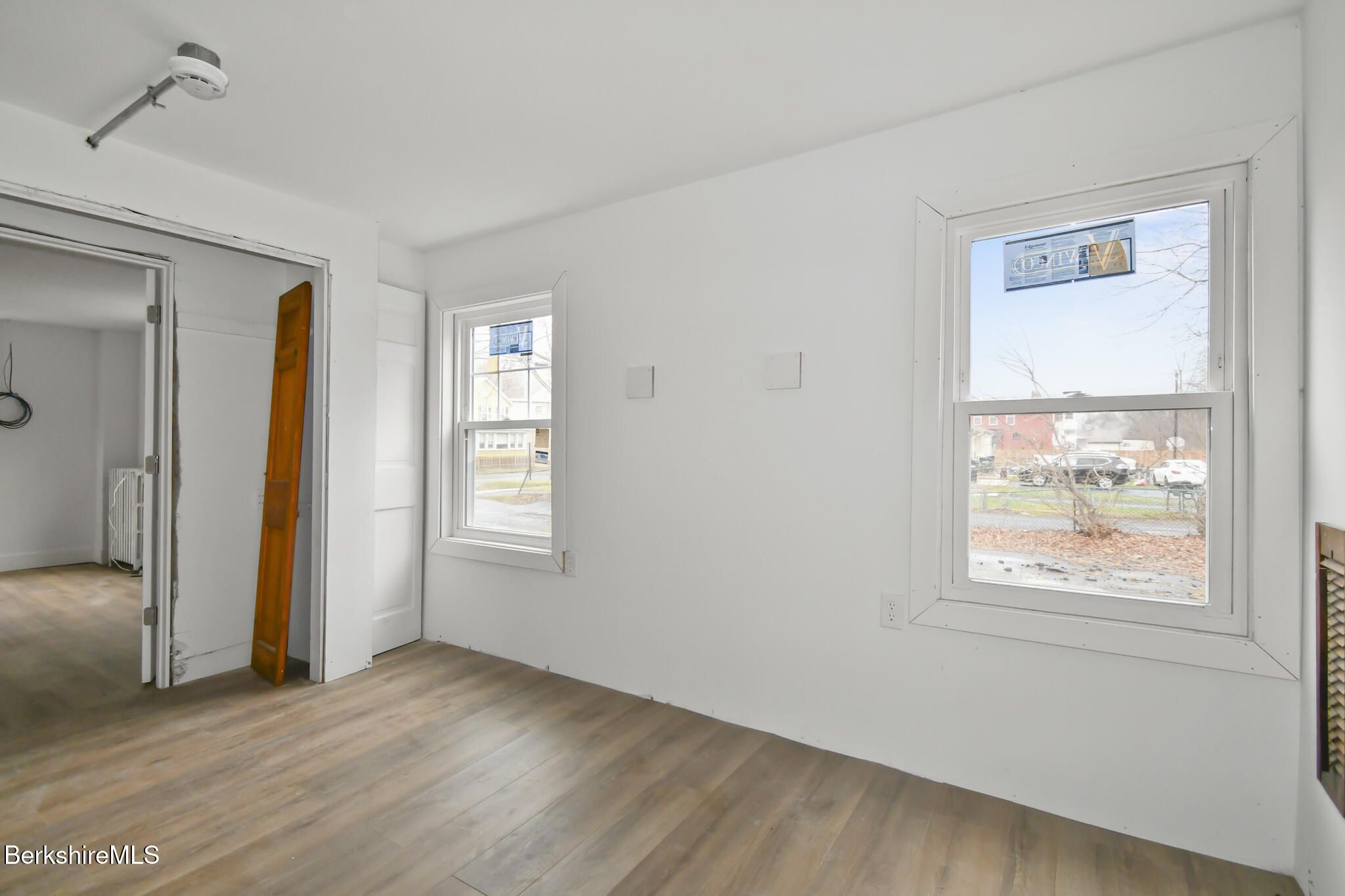 111 Columbia Street Adams, MA 01220 - Photo 24 of 33 a view of an empty room with wooden floor and a window