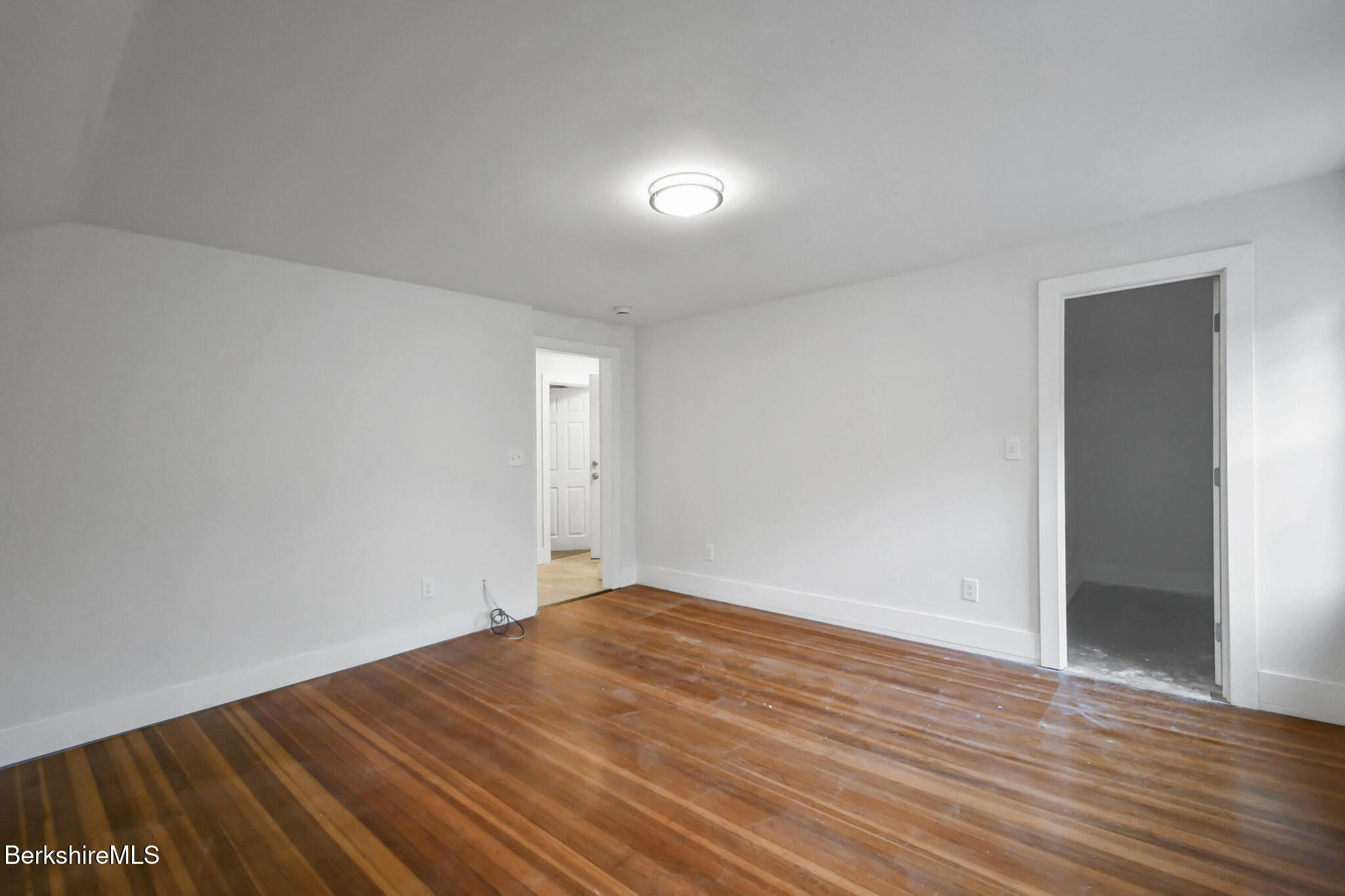111 Columbia Street Adams, MA 01220 - Photo 5 of 33 a view of empty room with wooden floor