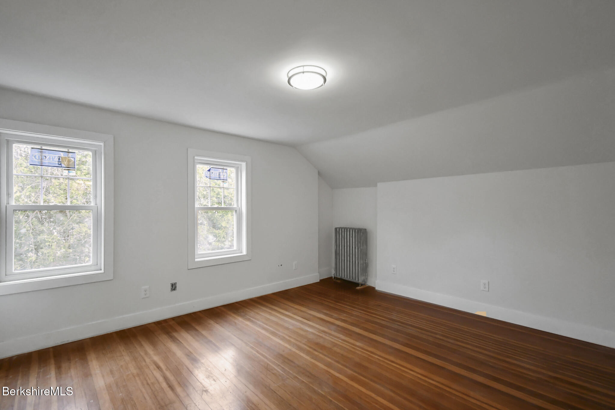 111 Columbia Street Adams, MA 01220 - Photo 6 of 33 a view of empty room with wooden floor and fan