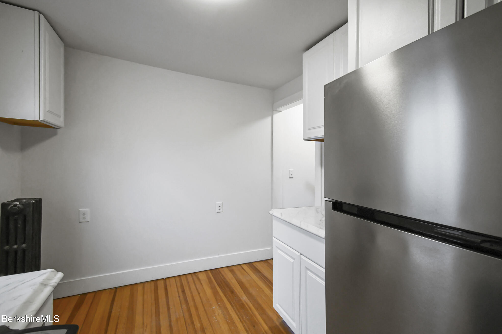 111 Columbia Street Adams, MA 01220 - Photo 10 of 33 a view of empty room with wooden floor