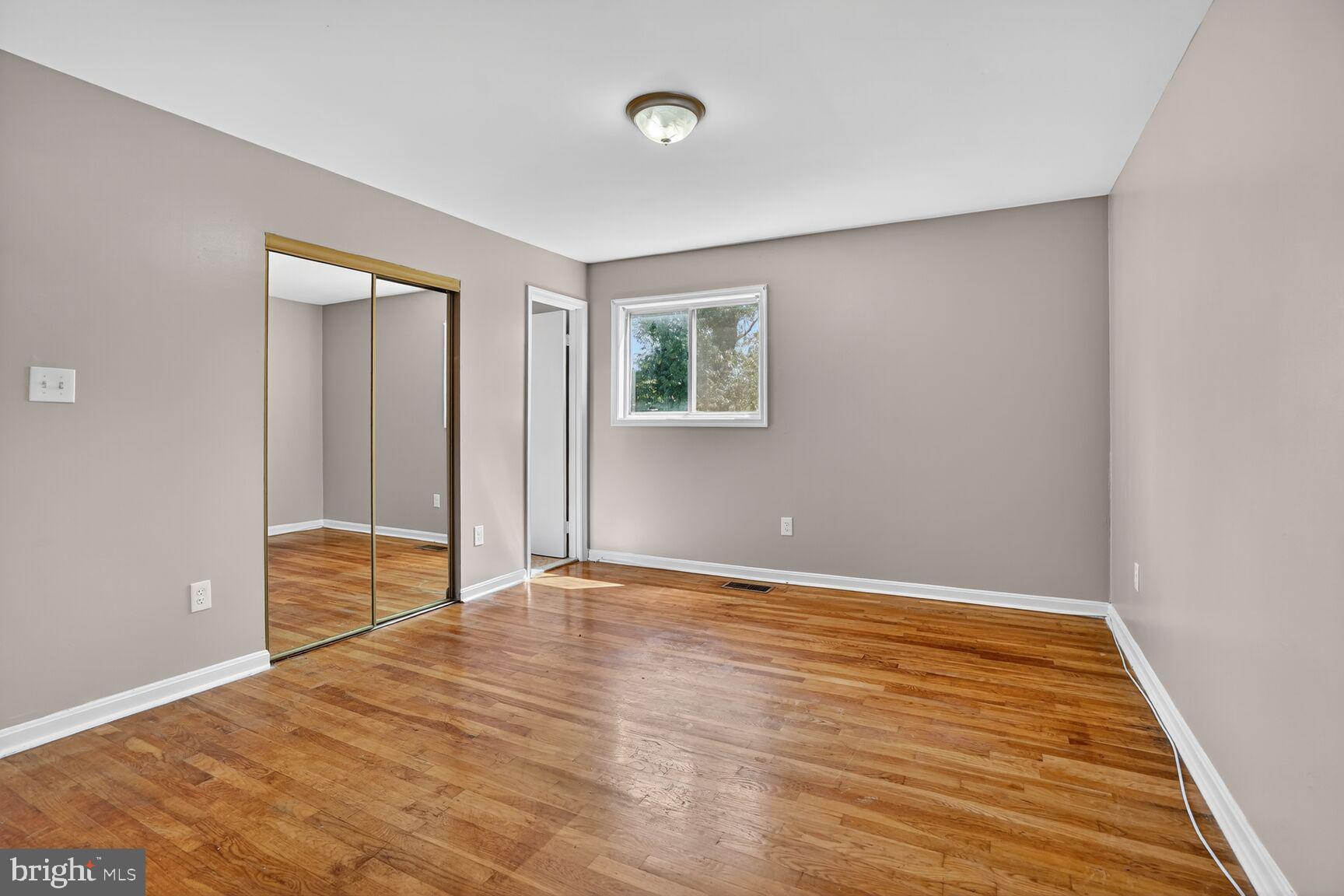 7720 Loudon Drive Fort Washington, MD 20744 - Photo 15 of 28 a view of an empty room with wooden floor