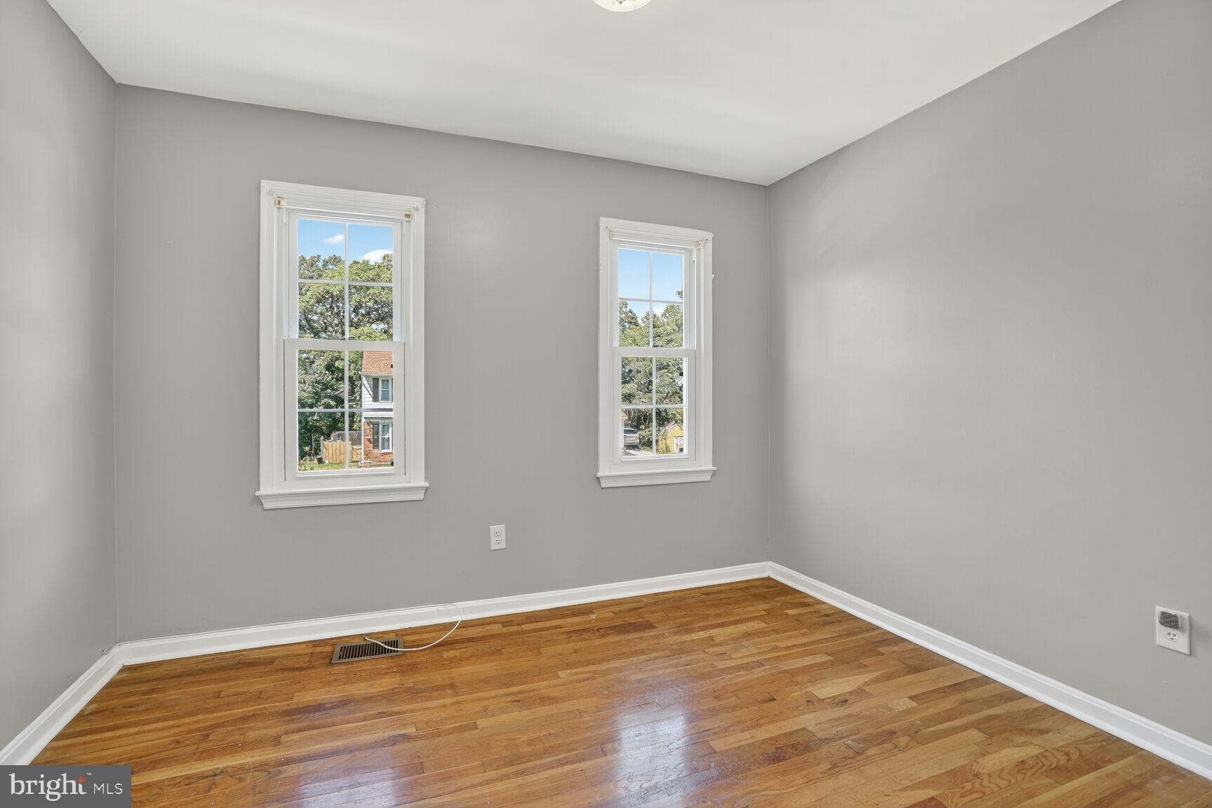 7720 Loudon Drive Fort Washington, MD 20744 - Photo 16 of 28 a view of an empty room with wooden floor and a window