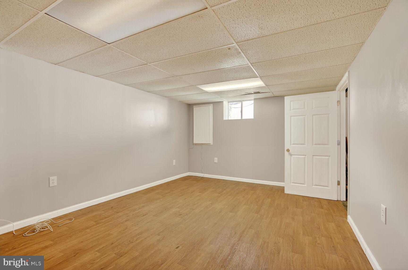 7720 Loudon Drive Fort Washington, MD 20744 - Photo 19 of 28 a view of a room with wooden floor and white walls