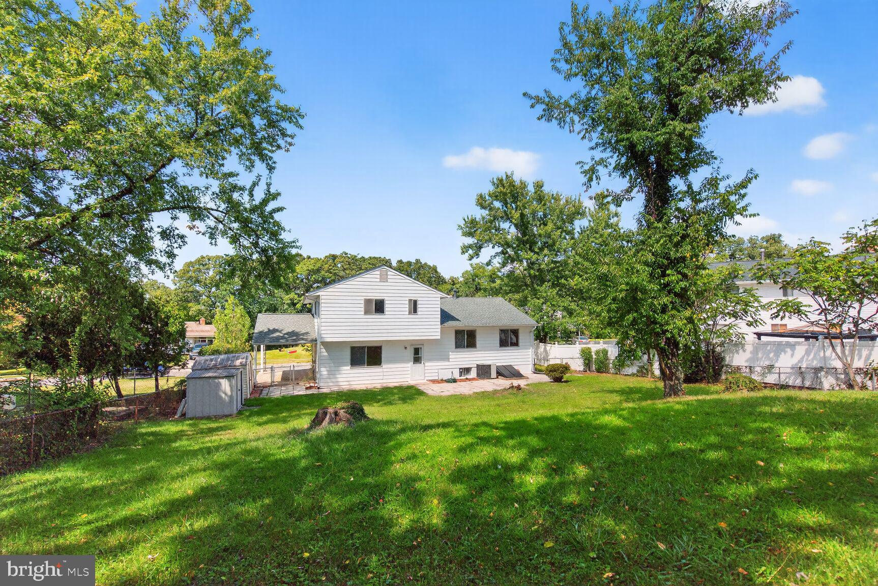 7720 Loudon Drive Fort Washington, MD 20744 - Photo 20 of 28 a front view of a house with a yard table and chairs