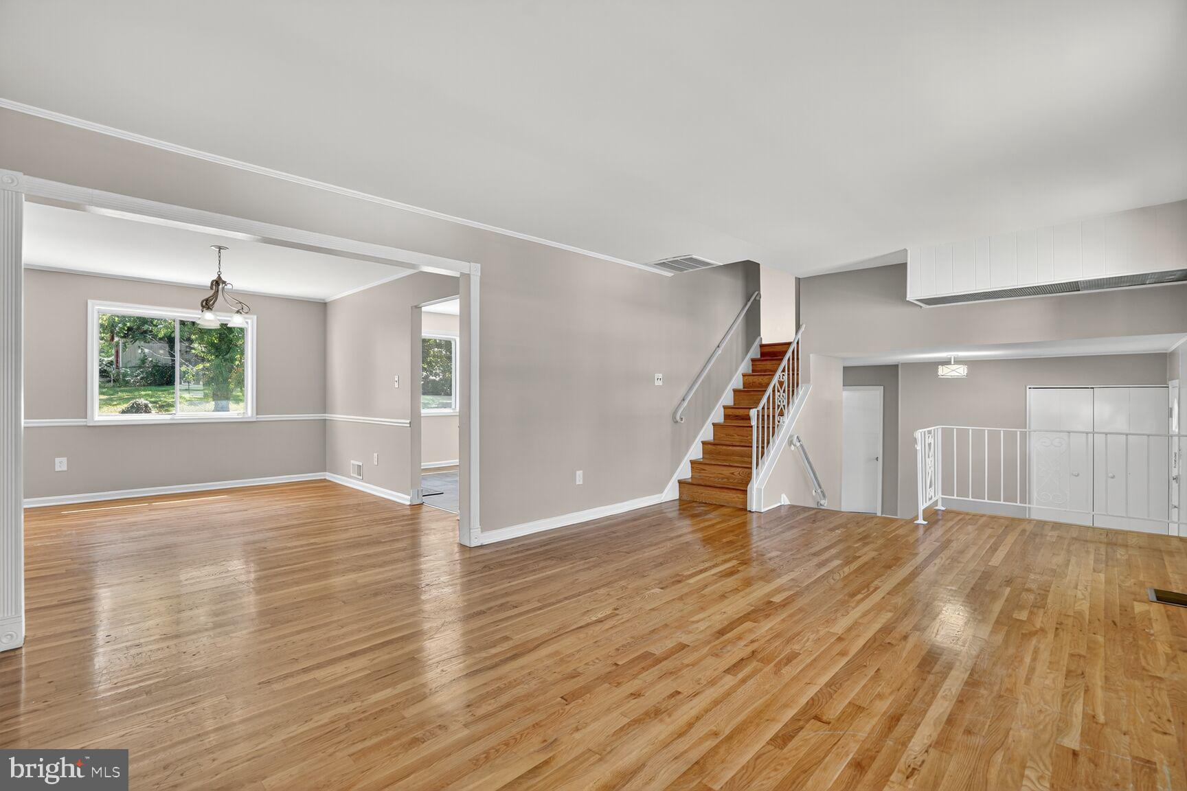 7720 Loudon Drive Fort Washington, MD 20744 - Photo 2 of 28 a view of an empty room with wooden floor and stairs