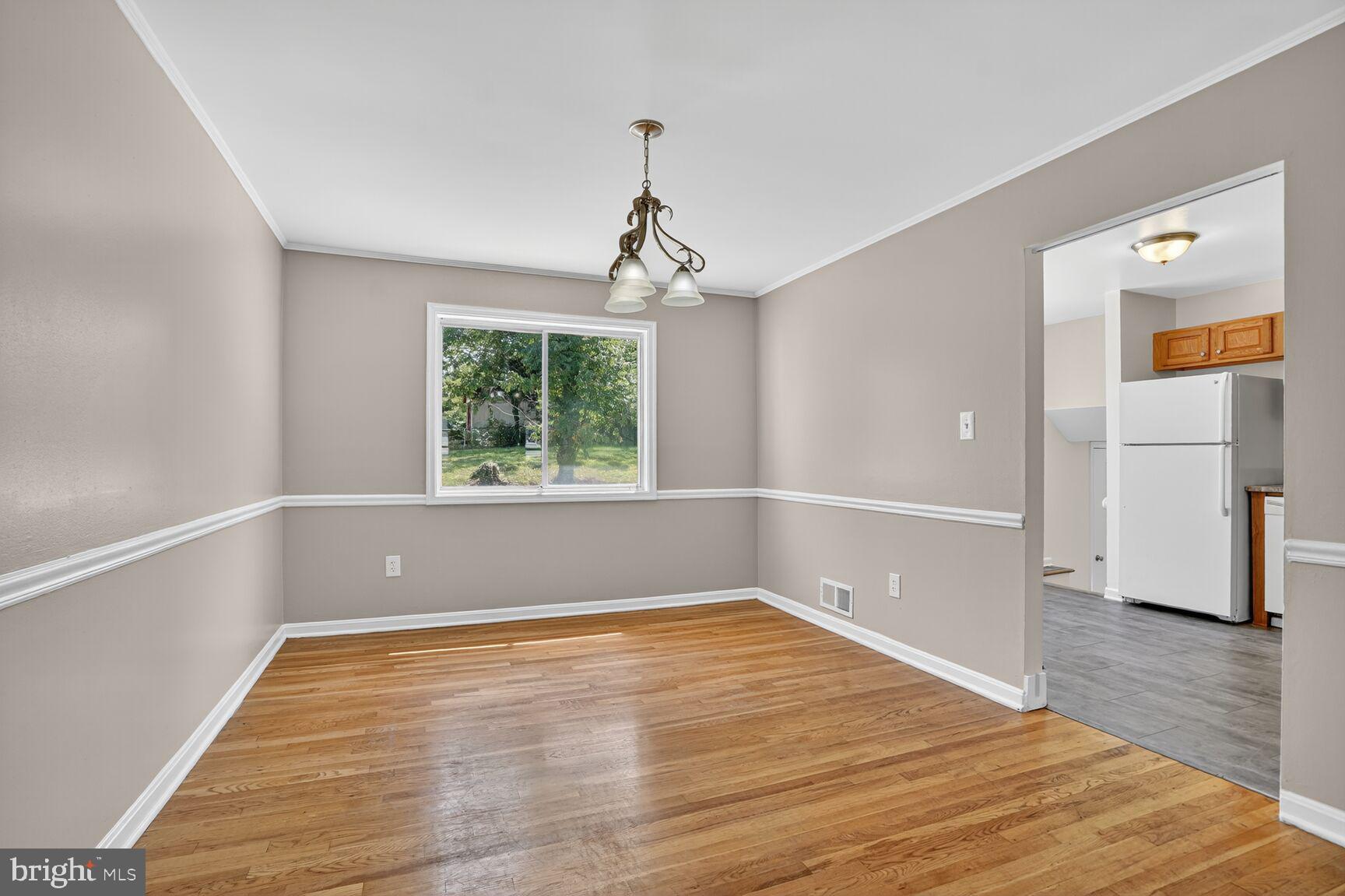 7720 Loudon Drive Fort Washington, MD 20744 - Photo 4 of 28 a view of empty room with wooden floor and fan