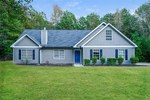 a front view of a house with a yard