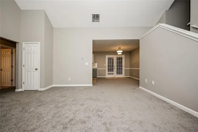 a view of empty room with windows