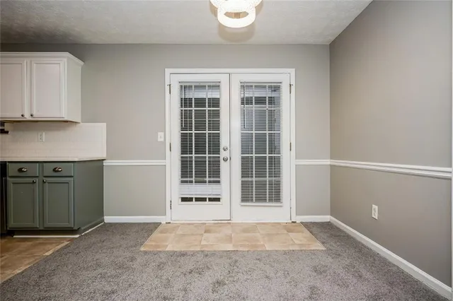 a kitchen with stainless steel appliances granite countertop a stove a refrigerator and a refrigerator