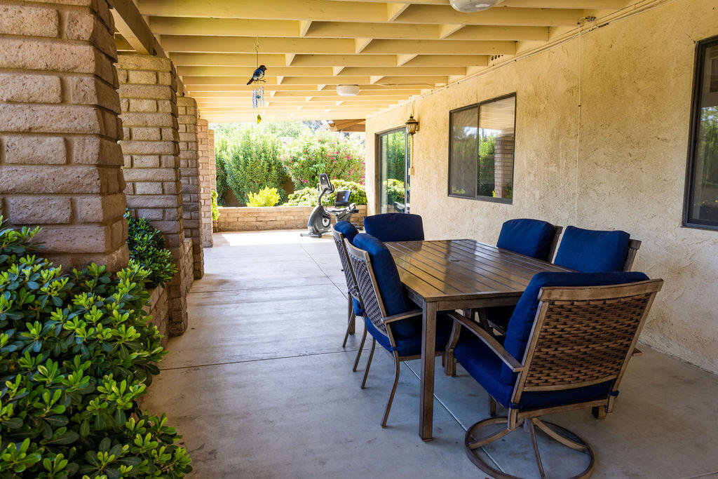 812 West Vicki Avenue Ridgecrest, CA 93555 - Photo 12 of 68 a dining room with furniture and a floor to ceiling window