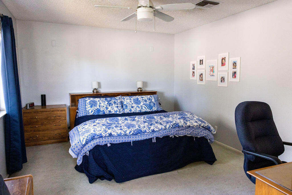 812 West Vicki Avenue Ridgecrest, CA 93555 - Photo 20 of 68 a bedroom with a bed and a chair